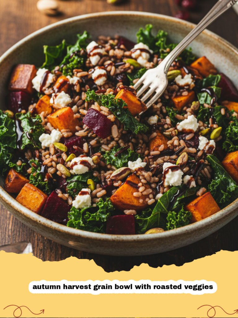 A colorful autumn harvest grain bowl with roasted veggies, kale, and pecans in a ceramic bowl.