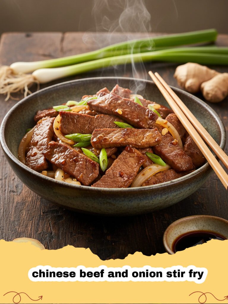 chinese beef and onion stir fry - A steaming plate of Chinese beef and onion stir fry with glossy sauce and green onion garnish