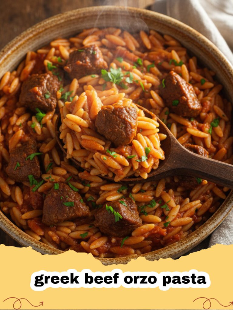 greek beef orzo pasta - A close-up shot of Greek Beef Orzo Pasta in a ceramic bowl topped with feta and parsley.