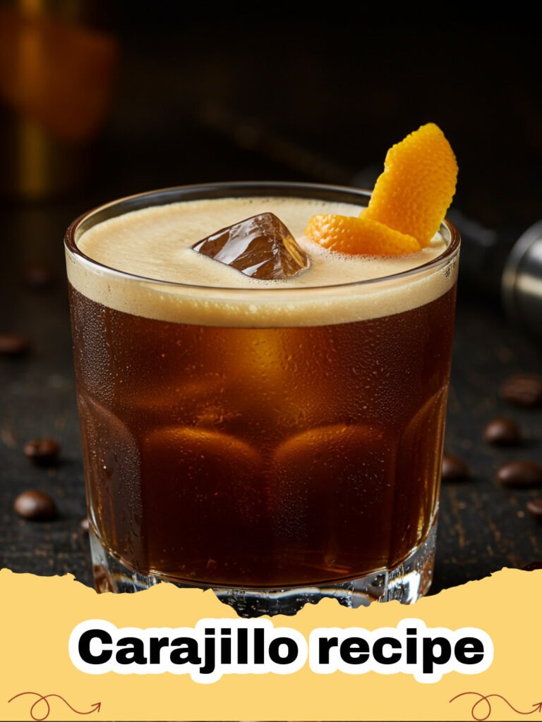 Carajillo recipe - A frothy Mexican Carajillo cocktail in a rocks glass with ice and coffee beans on top.