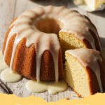 A perfectly golden-brown Slap Ya Momma Pound Cake on a wire rack, dusted with powdered sugar, ready to be sliced.