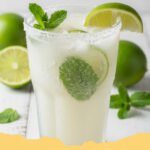 coconut mojito mocktail recipe - A refreshing coconut mojito mocktail in a tall glass, garnished with fresh mint and lime, set against a tropical background.