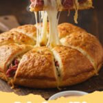 Golden brown Reuben Crescent Bake in a baking dish, sliced to show layers of corned beef, sauerkraut, and Swiss cheese.