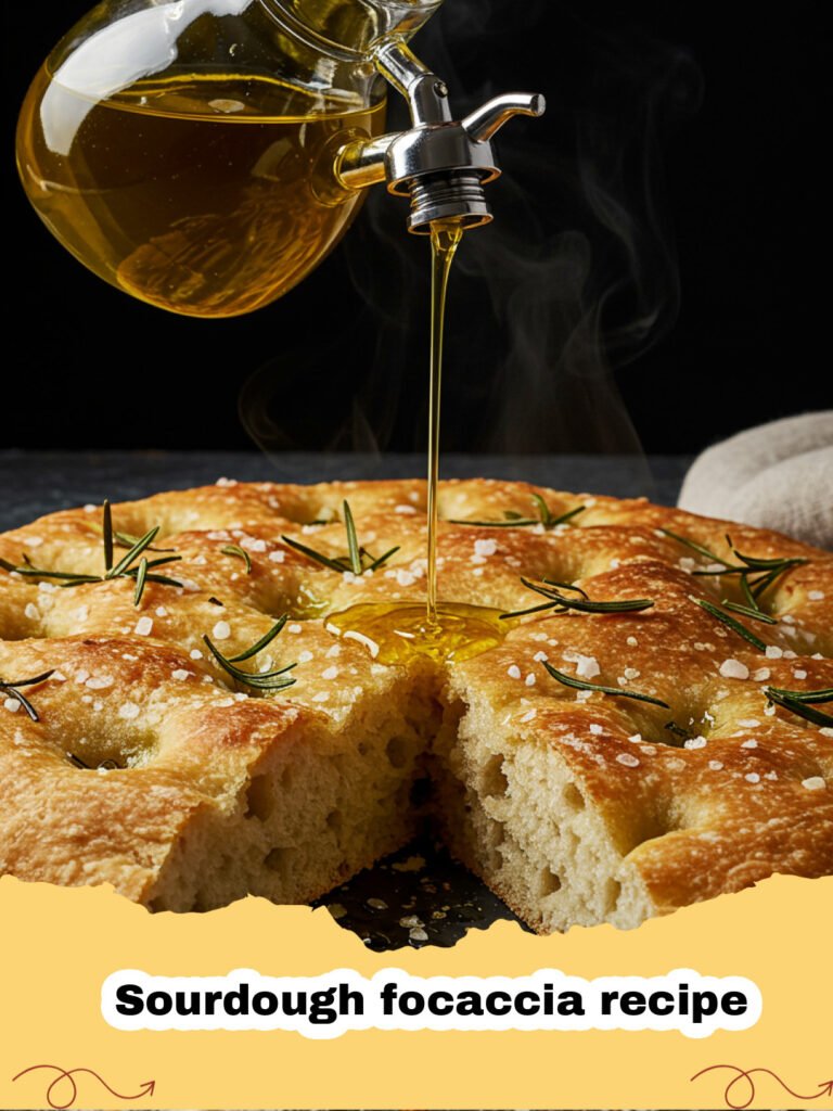 Sourdough focaccia recipe - A golden brown sourdough focaccia with large bubbles and rosemary needles on top.
