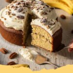 Heavenly Banana Bread Cake Cream Cheese Frosting - A perfectly frosted slice of Heavenly Banana Bread Cake with Cream Cheese Frosting, showing moist cake layers and creamy white frosting.