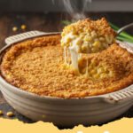 corn casserole recipe - Golden brown and bubbly creamy corn casserole in a baking dish, ready to be served.