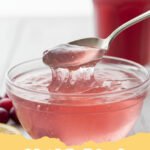Vibrant pink gelatin cubes in a glass bowl with fresh berries, showcasing a delicious pink gelatin diet recipe