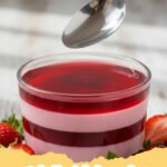 gelatin trick recipe - A vibrant, perfectly wobbly gelatin dessert with fruit suspended inside, glistening under the light.