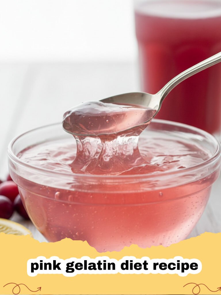 A shimmering bowl of pink gelatin diet recipe, garnished with fresh raspberries and mint.