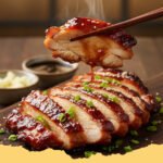 Quick Easy Chicken Char Siu Recipe - Close-up of perfectly glazed and sliced Quick Easy Chicken Char Siu served over rice with green onions.