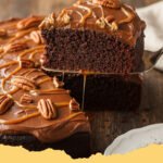 Turtle Texas Sheet Cake Recipe Fudge Caramel Pecans - A large, rectangular Turtle Texas Sheet Cake, topped with rich fudge frosting, gooey caramel drizzles, and crunchy chopped pecans, ready to be sliced.