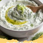 tzatziki recipe - Bowl of creamy homemade tzatziki with fresh dill and cucumber garnish on a wooden board.