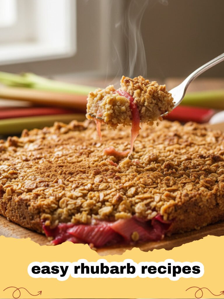 easy rhubarb recipes - Close-up of a warm, bubbly rhubarb crisp with a golden oat topping, served in a square baking dish.