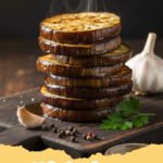 eggplant recipes easy - A vibrant close-up of golden-brown roasted eggplant cubes sprinkled with fresh herbs and crumbled feta.