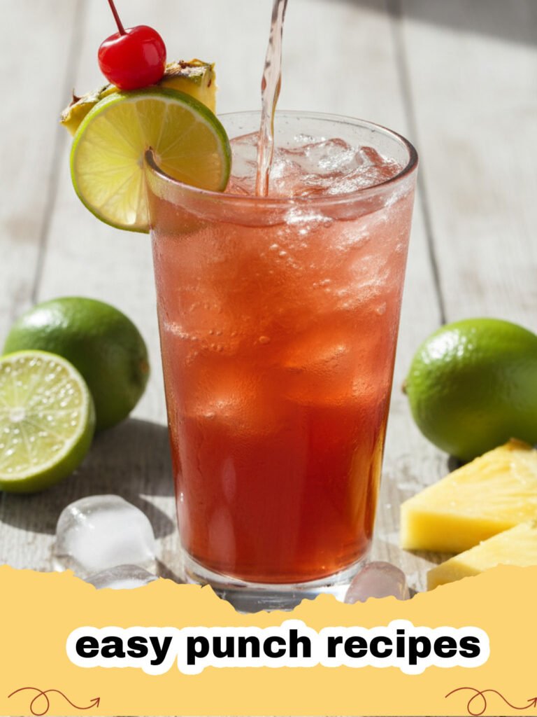 easy punch recipes - A vibrant red and orange festive fruit punch in a large glass punch bowl with sliced citrus and berries floating, ready for a party.