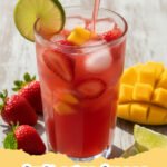 A vibrant pitcher and glasses filled with red fruit agua fresca, garnished with lime and mint on a rustic wooden table with fresh watermelon slices.