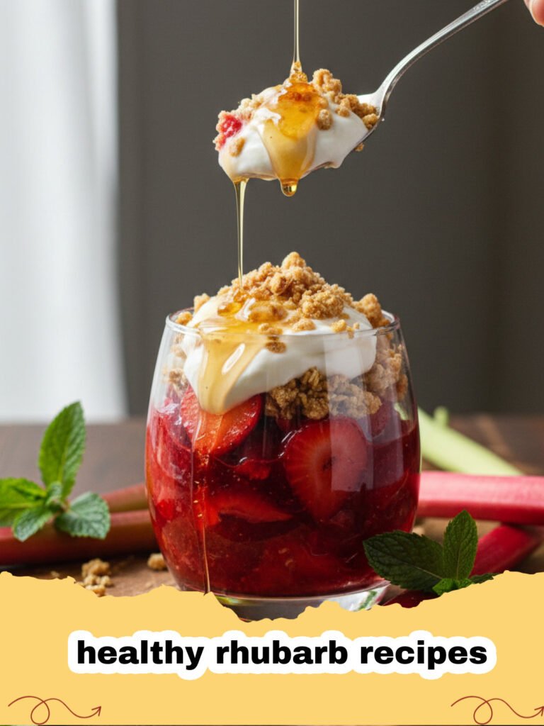 healthy rhubarb recipes - A golden brown healthy rhubarb crumble in a white baking dish, with a scoop removed showing the tender rhubarb filling.