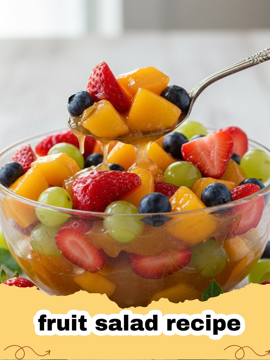 fruit salad recipe - A vibrant fruit salad in a large glass bowl with a honey-lime dressing drizzle, showcasing fresh strawberries, blueberries, grapes, kiwi, mango, and pineapple.