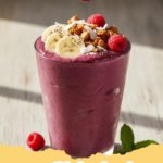 smoothie bowl recipe - A beautifully garnished Berry Blast Smoothie Bowl with fresh berries, granola, and chia seeds on a wooden background, ready to be eaten for breakfast.