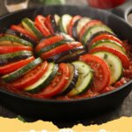ratatouille recipe - A vibrant and colorful bowl of classic French ratatouille, garnished with fresh basil.