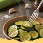 easy zucchini recipes - Close-up of golden brown, bubbly Easy Cheesy Baked Zucchini in a white baking dish.