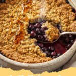 healthy blueberry recipes - Delicious and healthy blueberry crumb bars with an oat topping, cut into squares on a wooden board.