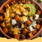 sweet potato bowl recipes - A vibrant and healthy sweet potato bowl filled with roasted sweet potatoes, black beans, avocado, feta, and cilantro.