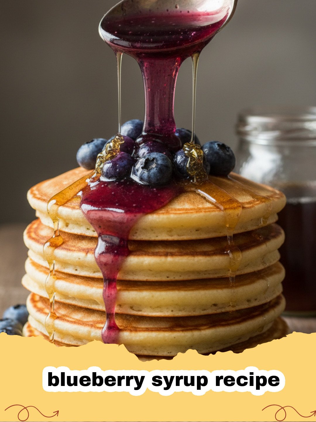 blueberry syrup recipe - Close-up of a glass jar filled with vibrant purple homemade blueberry syrup, with a small spoon resting on the rim and fresh blueberries scattered around.