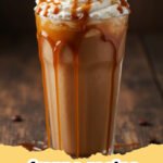 frappe recipe - A tall glass of creamy homemade coffee frappe topped with whipped cream and a drizzle of caramel sauce, with coffee beans scattered around.