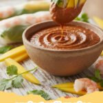 spring roll recipe - A platter of golden brown crispy spring rolls with a side of sweet chili dipping sauce.