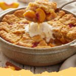 fresh peach cobbler recipe - A golden brown fresh peach cobbler with a scoop of melting vanilla ice cream.