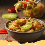 chow chow recipe - Jars of homemade Southern sweet and tangy chow chow relish, showcasing chopped green tomatoes, cabbage, and peppers in a golden brine.