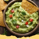 avocado recipes - A bowl of fresh green avocado mash with red onions and cilantro