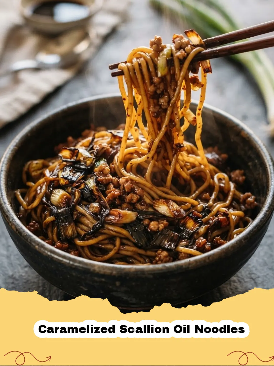 Close-up of Caramelized Scallion Oil Noodles in a bowl, garnished with crispy and fresh green onions.