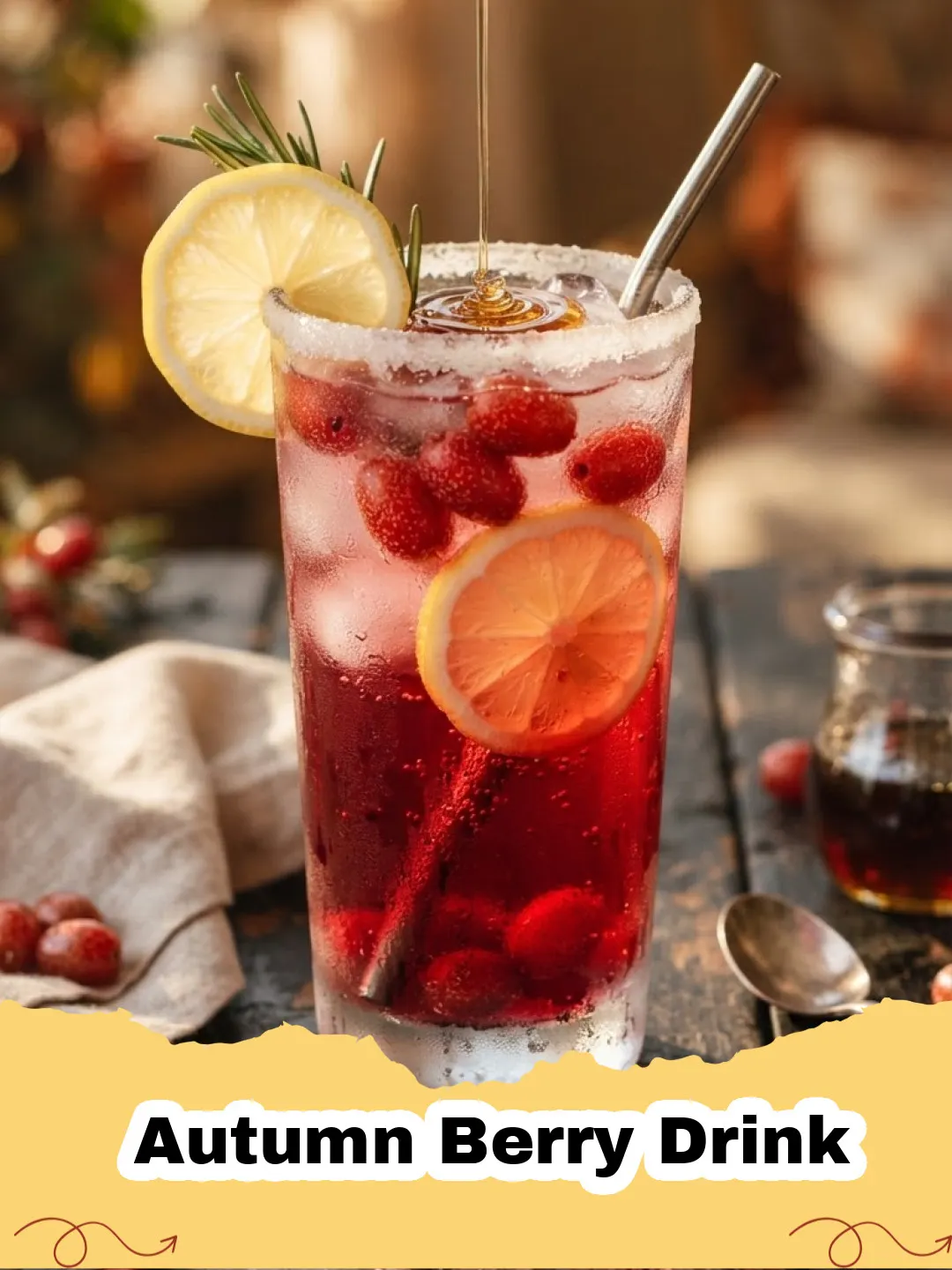 A steaming mug of Autumn Berry Drink garnished with cinnamon stick and fresh berries, with autumn leaves in the background.