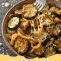 zuchinis recipe - A golden brown cheesy herb zucchini bake in a baking dish, fresh from the oven.