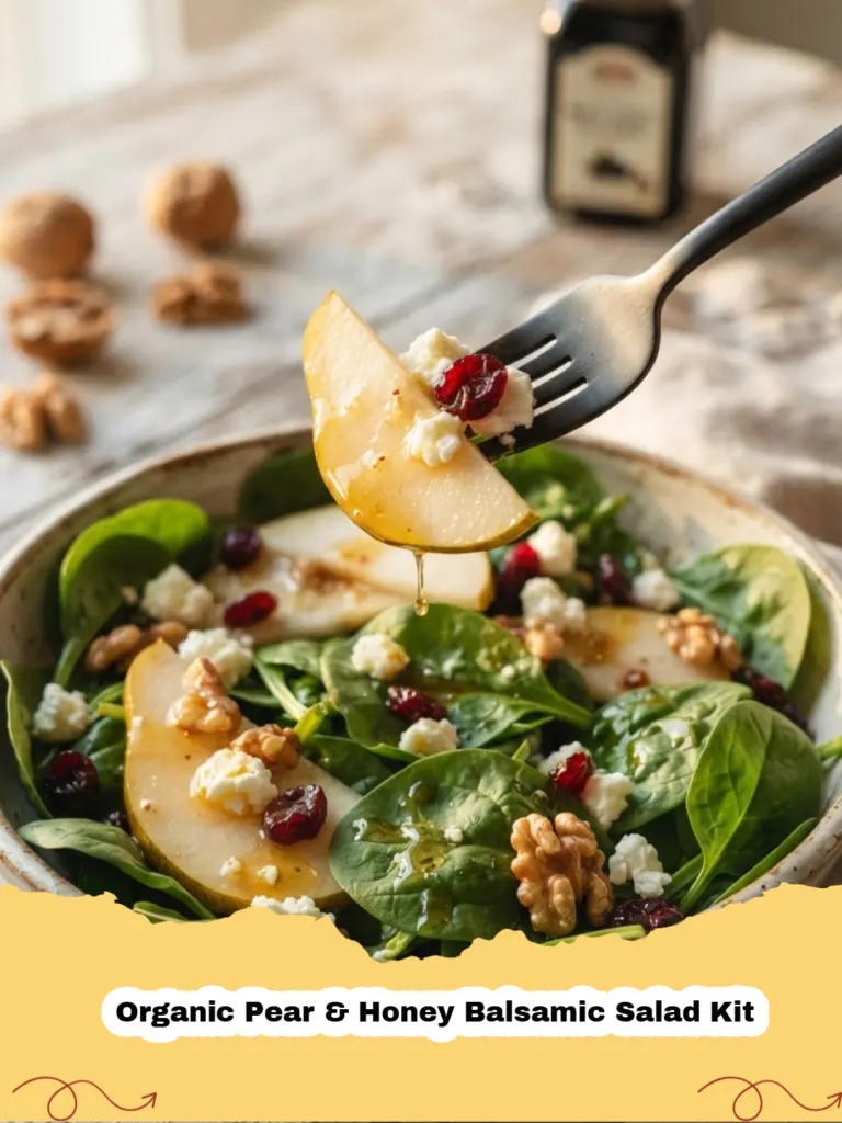 Organic Pear & Honey Balsamic Salad Kit - A beautifully plated Organic Pear and Honey Balsamic Salad Kit with vibrant greens, sliced pears, crumbled goat cheese, and toasted pecans.