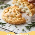 Pile of golden-brown fluffy Cloud Bread pieces on a cooling rack.