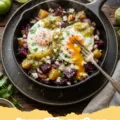 tomatillo recipes - A bowl of roasted tomatillo salsa verde with chips and fresh ingredients on the side.