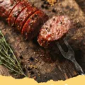 summer sausage recipes - Close-up of a hearty summer sausage and potato skillet, garnished with fresh herbs, showcasing crispy sausage slices and browned potatoes.