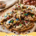 Cookie Nachos - A colorful platter of ultimate cookie nachos piled high with chocolate sauce, caramel, marshmallows, candies, and fresh berries, ready for sharing.