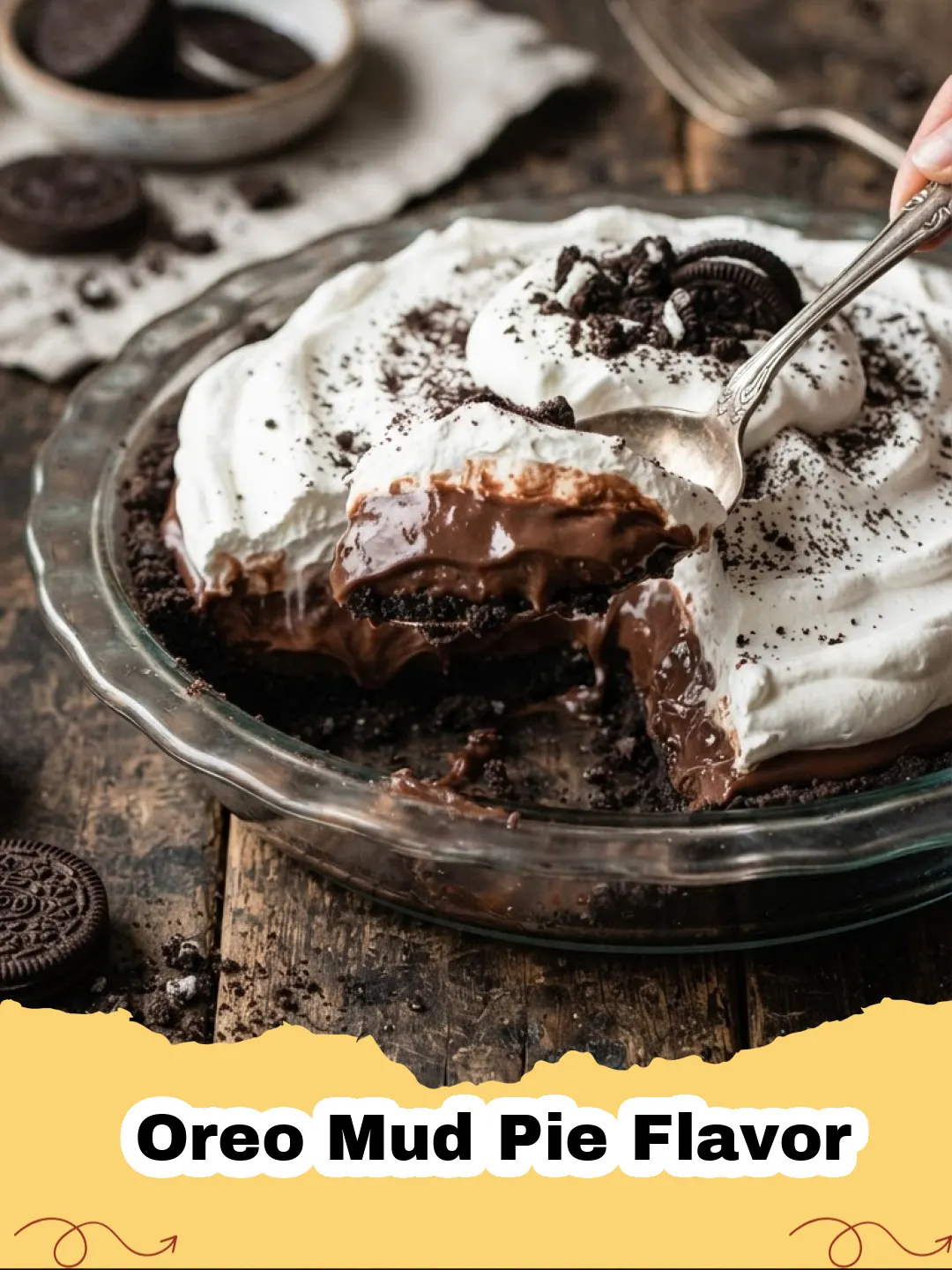 Oreo Mud Pie Flavor - A perfectly sliced No-Bake Oreo Mud Pie with a crunchy crust, dark chocolate filling, and white whipped topping, garnished with crushed Oreos.