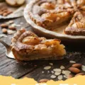 Beautifully baked Pear and Almond Tart with golden frangipane and perfectly arranged pear slices on a cooling rack.