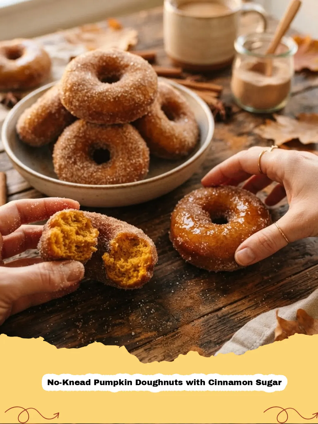 Pile of fluffy, golden No-Knead Pumpkin Doughnuts with Cinnamon Sugar on a cooling rack, with fall leaves in the background.