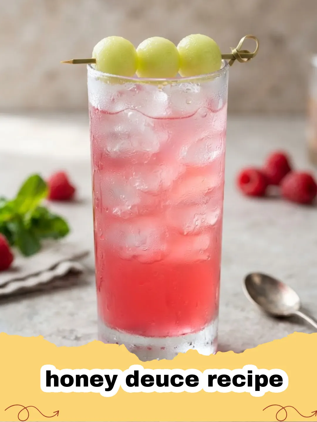 honey deuce recipe - A vibrant green Honey Deuce cocktail in a tall glass, garnished with three honeydew melon balls on a skewer and fresh raspberries.