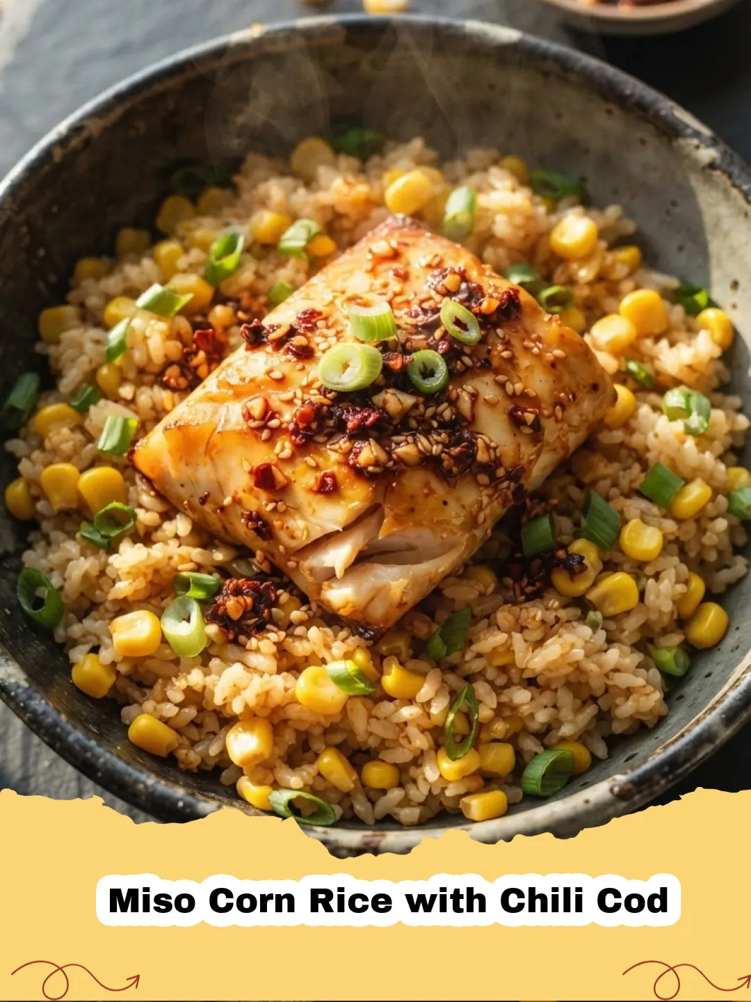 Close-up of Miso Corn Rice with Chili Cod garnished with scallions and sesame seeds in a ceramic bowl.
