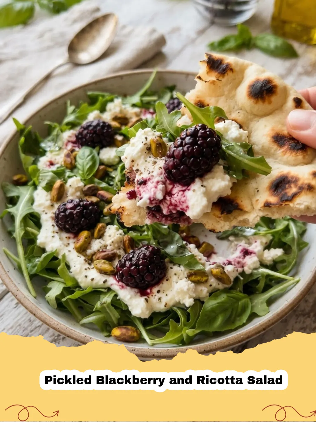 A vibrant Pickled Blackberry and Ricotta Salad with arugula, pistachios, and fresh basil on a white platter.